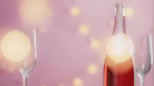 woman hand take away glass with pink sparkling wine