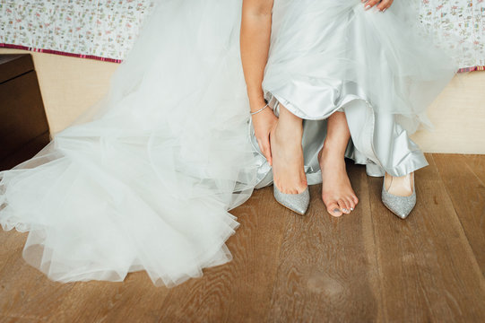 beautiful and athletic legs of the bride in wedding shoes