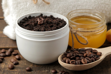 Obraz na płótnie Canvas homemade coffee scrub in a white jar for the face and body and various ingredients for making scrub. spa. cosmetics. care cosmetics
