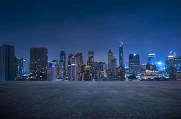 Bangkok urban cityscape skyline night scene with empty asphalt floor on front - Powered by Adobe