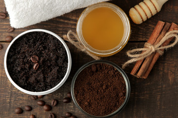 homemade coffee scrub in a white jar for the face and body and various ingredients for making scrub. spa. cosmetics. care cosmetics