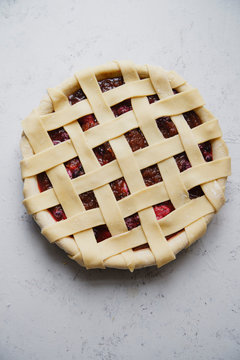 Overhead view of strawberry pie on marble