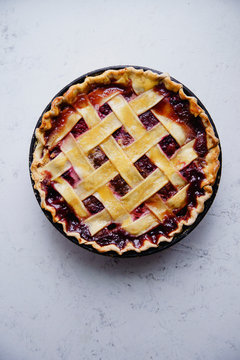 Overhead view of strawberry pie on marble