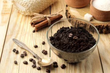homemade coffee scrub in the face and body bowl and various ingredients for making scrub on a wooden table. spa. cosmetics. care cosmetics.