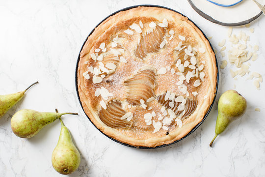 Tart with poached pears and almond frangipane