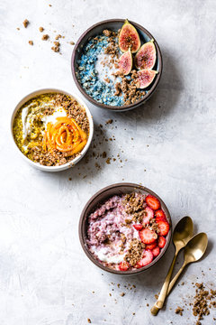 Overhead view of colorful oatmeal with fruits and granola