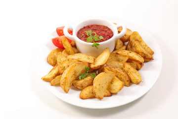 french fries and tomato sauce on white background