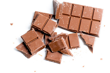 chocolate bar, shavings and cookies on a table