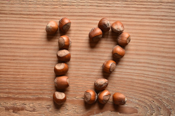 the number 12 shaped with hazelnuts