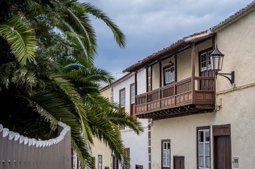 Fototapeta na wymiar Traditional Canary islands wooden balcony in Garachico. Tenerife, Spain.
