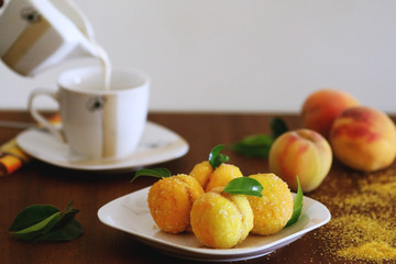 Peach shaped cookies with nut and caramelized milk inside