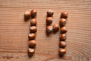 the number 14 shaped with hazelnuts