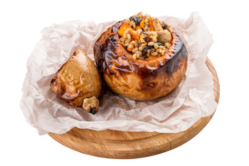 Pumpkin baked with perlotto and nuts. Vegetarian dish. On white background