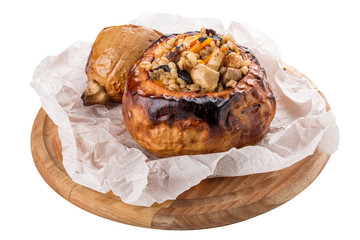 Pumpkin baked with perlotto and nuts. Vegetarian dish. On white background