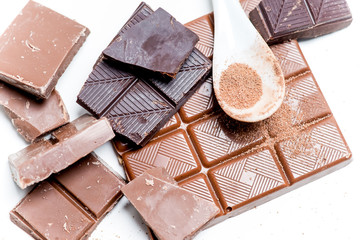 chocolate bar, shavings and cookies on a table