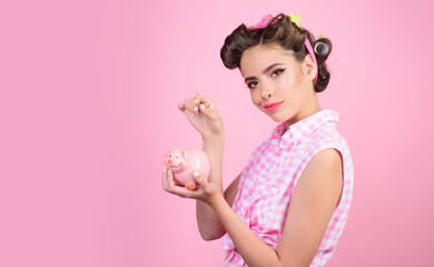 pin up woman with trendy makeup. pinup girl with fashion hair. retro woman with moneybox. loan. Money. Housewife. pretty girl in vintage style, copy space. You spend too much money