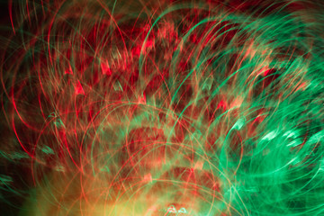 Defocused colored luminous spots and curved lines. For background