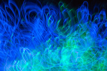 Defocused colored luminous spots and curved lines. For background