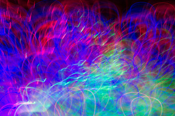 Defocused colored luminous spots and curved lines. For background