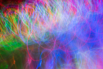 Defocused colored luminous spots and curved lines. For background