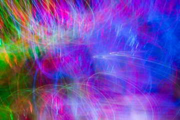 Defocused colored luminous spots and curved lines. For background