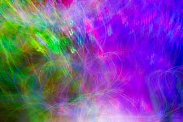 Defocused colored luminous spots and curved lines. For background