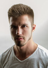 Obraz premium fashion man with unshaven beard. facial emotions. male grooming and barber. man. Beard and facial care. Fashion portrait of man. Personal care. skincare in any season