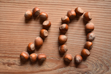 the number 20 shaped with hazelnuts