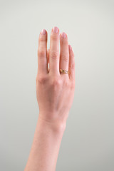 female hand against white background