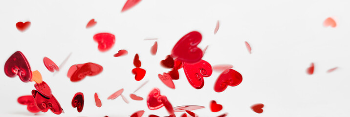 a lot of flying and falling hearts on white background. Valentine's Day. symbol of love, long banner