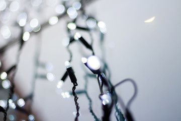 Christmas lights background with bokeh. New Year glowing garland