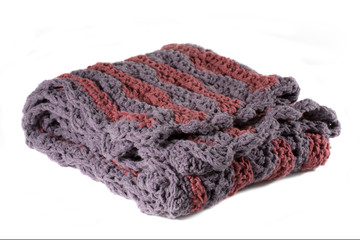 Purple and rose handcrafted crocheted afghan throw blanket isolated on a white background