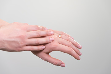 female hand against white background