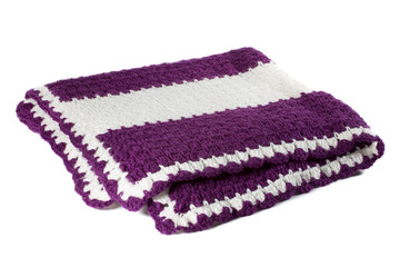Handcrafted violet purple and white crochet afghan throw blanket isolated on a white background