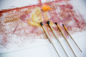 Artistic palette with paint brushes and oil paint