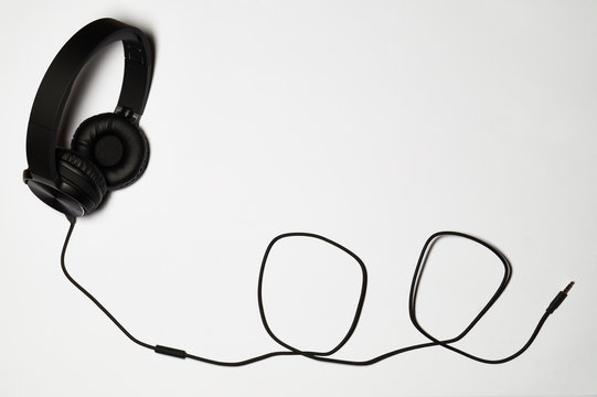 Black audio headphones isolated on white background