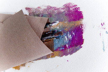 Artistic palette with paint brushes and oil paint