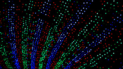 Background of colorful Christmas themed holiday light display with bokeh