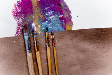 Artistic palette with paint brushes and oil paint