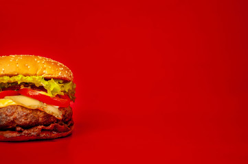 delicious, tasty homemade burger on a red background