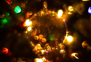 Glass Sphere Christmas Ornament is Lit by Multi-Colored Lights, Creating an Abstract Effect