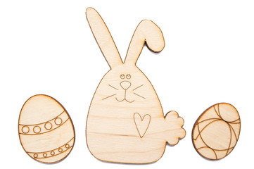 Two wooden handmade easter eggs and easter bunny isolated on a white