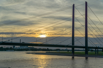 Bridge on river at sunset