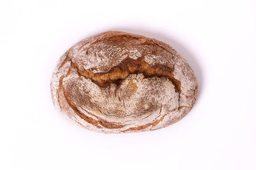 Loaf of organic farmer's bread, isolated on white background