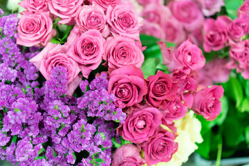 Romantic flower bunch background for anniversary and valentine day (pink roses and purple flowers)
