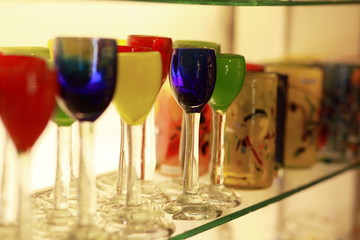Colored glasses of wine on the shelf