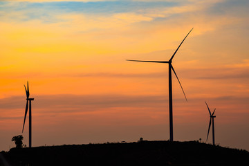 Obraz premium Silhouette of wind turbines farm