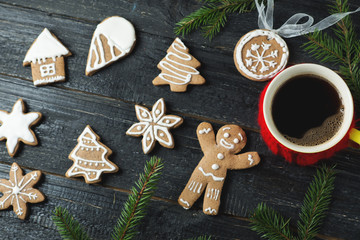 Christmas gingerbread cookies on a wooden table with a Cup of coffee