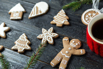 Christmas gingerbread cookies on a wooden table with a Cup of coffee