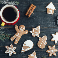 Christmas gingerbread cookies on a wooden table with a Cup of coffee